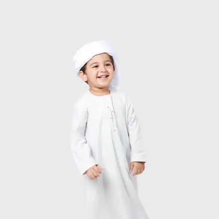 Boy in a white kandora and ghutra